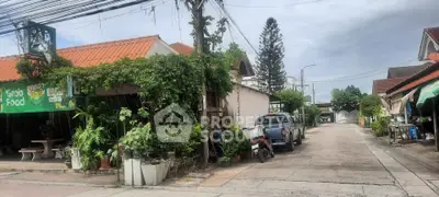 Charming suburban street view with lush greenery and cozy homes, perfect for tranquil living.