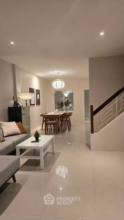 Modern living room with elegant dining area and stylish decor