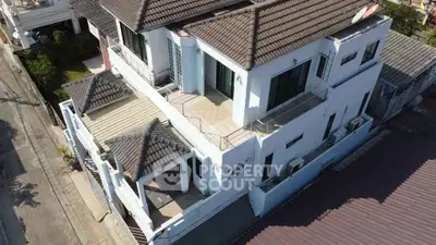 Stunning multi-level home with spacious balconies and modern design in a desirable neighborhood.