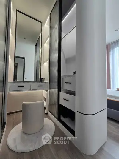 Modern bedroom with sleek built-in wardrobe and stylish vanity area