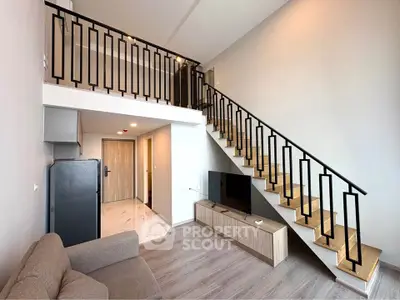 Modern loft apartment with stylish staircase and open living area