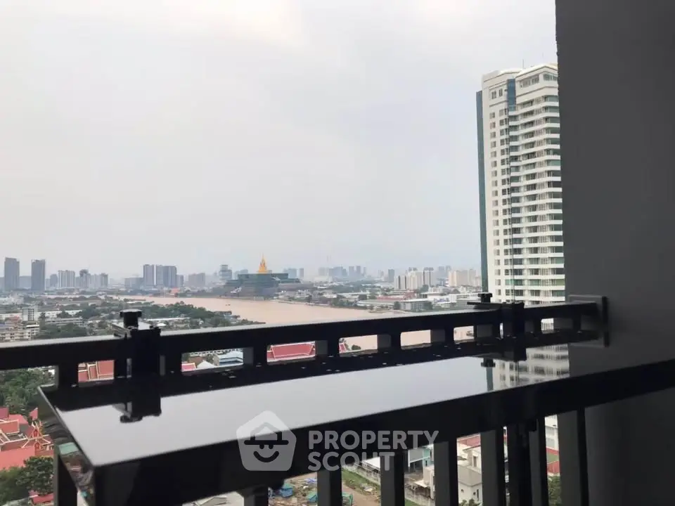 Stunning high-rise balcony view overlooking city skyline and river
