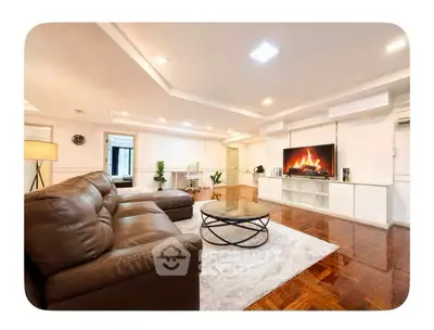 Spacious living room with modern decor and cozy fireplace in luxury apartment.
