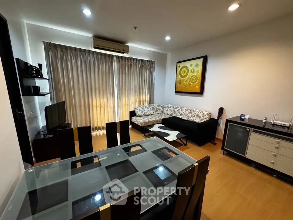Stylish living room with modern furniture and elegant decor in a cozy apartment setting.