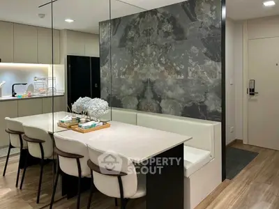Modern kitchen with sleek dining area and elegant decor