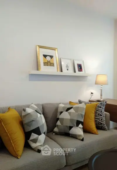 Stylish living room with modern decor and cozy sofa, perfect for relaxation.