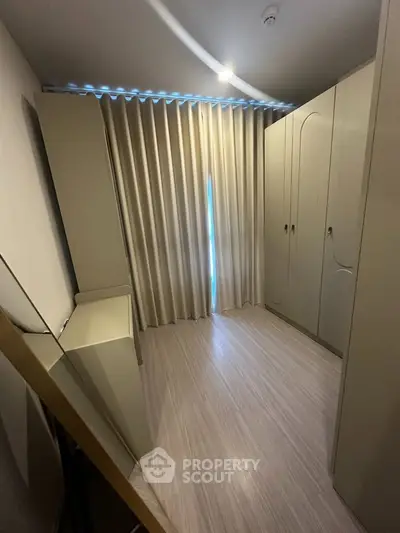 Spacious storage room with elegant cabinetry and natural light