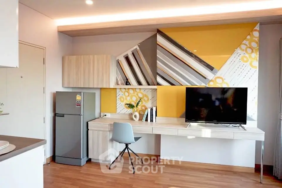 Modern living room with stylish decor, featuring a sleek TV setup and contemporary furniture.