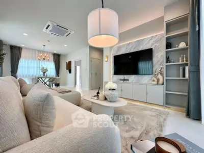 Luxurious modern living room with elegant decor and open dining area