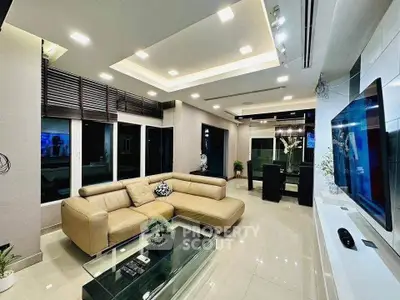Luxurious modern living room with sleek design and spacious layout, featuring a stylish leather sofa and elegant decor.