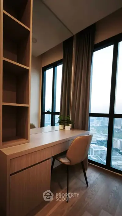 Modern study area with city view, featuring sleek wooden desk and chair, ideal for productivity.