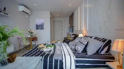Stylish modern bedroom with cozy decor and open layout in a contemporary apartment.