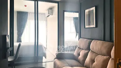 Modern apartment interior with cozy living room and stylish bedroom view.