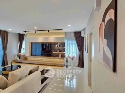Spacious modern living room with elegant decor and large TV unit
