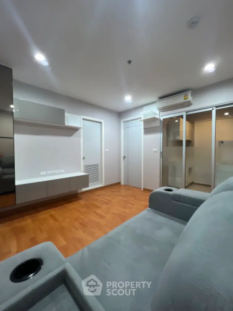 Modern living room with sleek design and wooden flooring