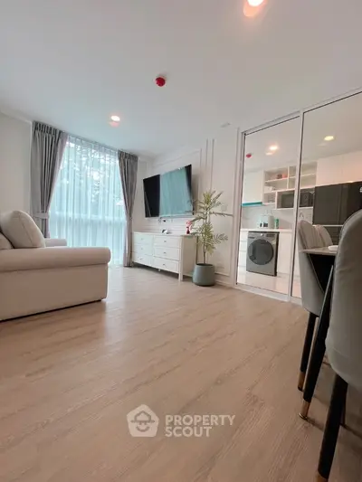 Modern living room with open kitchen and stylish decor