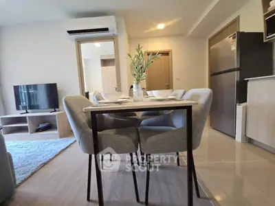 Modern living room with dining area and sleek kitchen appliances