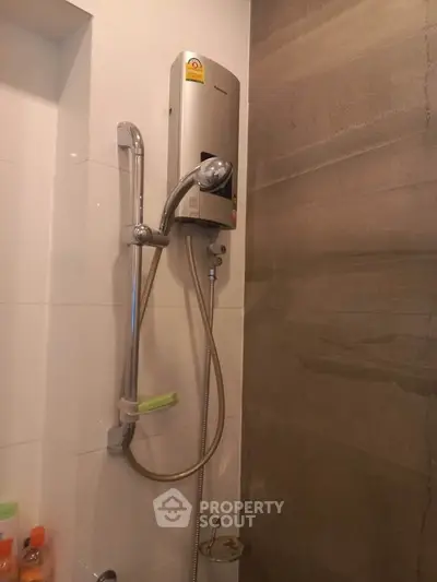 Modern bathroom with sleek shower unit and elegant tile design