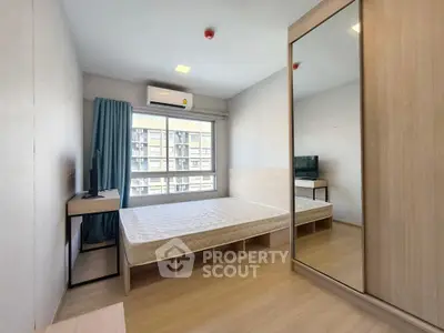 Modern bedroom with large window, mirrored wardrobe, and minimalist furniture