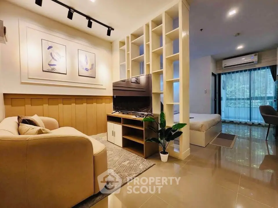 Modern open-plan living room with cozy sofa and stylish decor