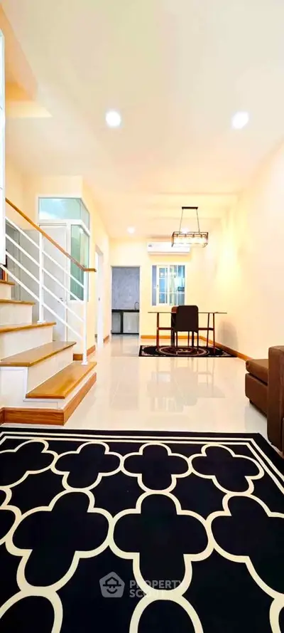 Spacious modern living room with elegant staircase and stylish decor
