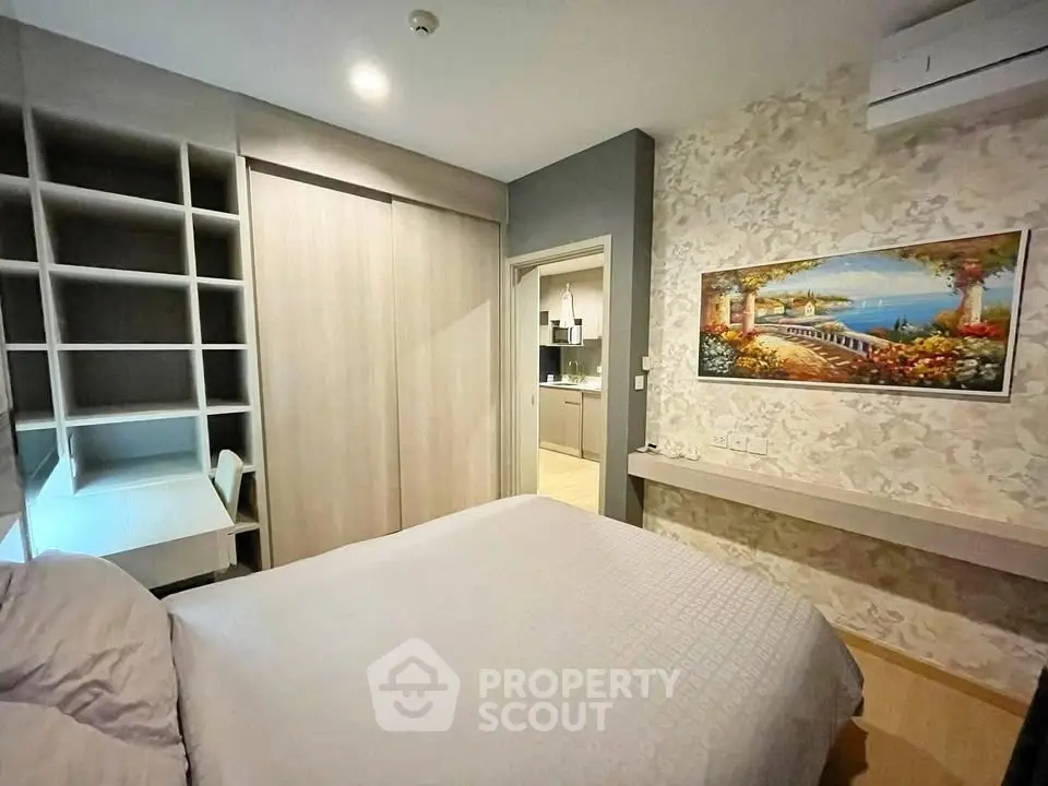 Cozy bedroom with built-in storage and elegant decor in modern apartment