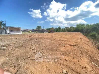 Expansive vacant land with clear skies, perfect for development opportunities.
