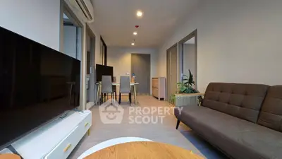 Modern living room with sleek furniture and open layout, perfect for urban living.