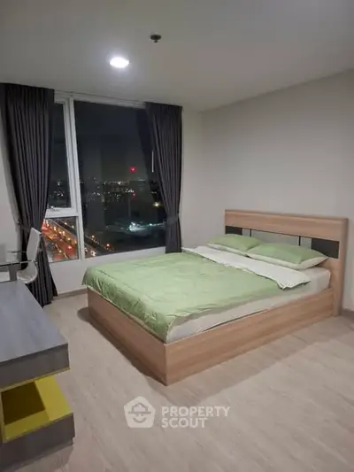 Modern bedroom with city view and stylish furnishings