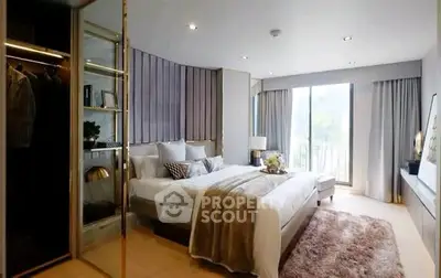 Luxurious bedroom with modern decor and large windows offering natural light.