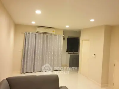 Cozy living room with modern lighting and air conditioning