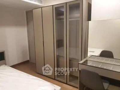 Modern bedroom with sleek wardrobe and stylish vanity desk