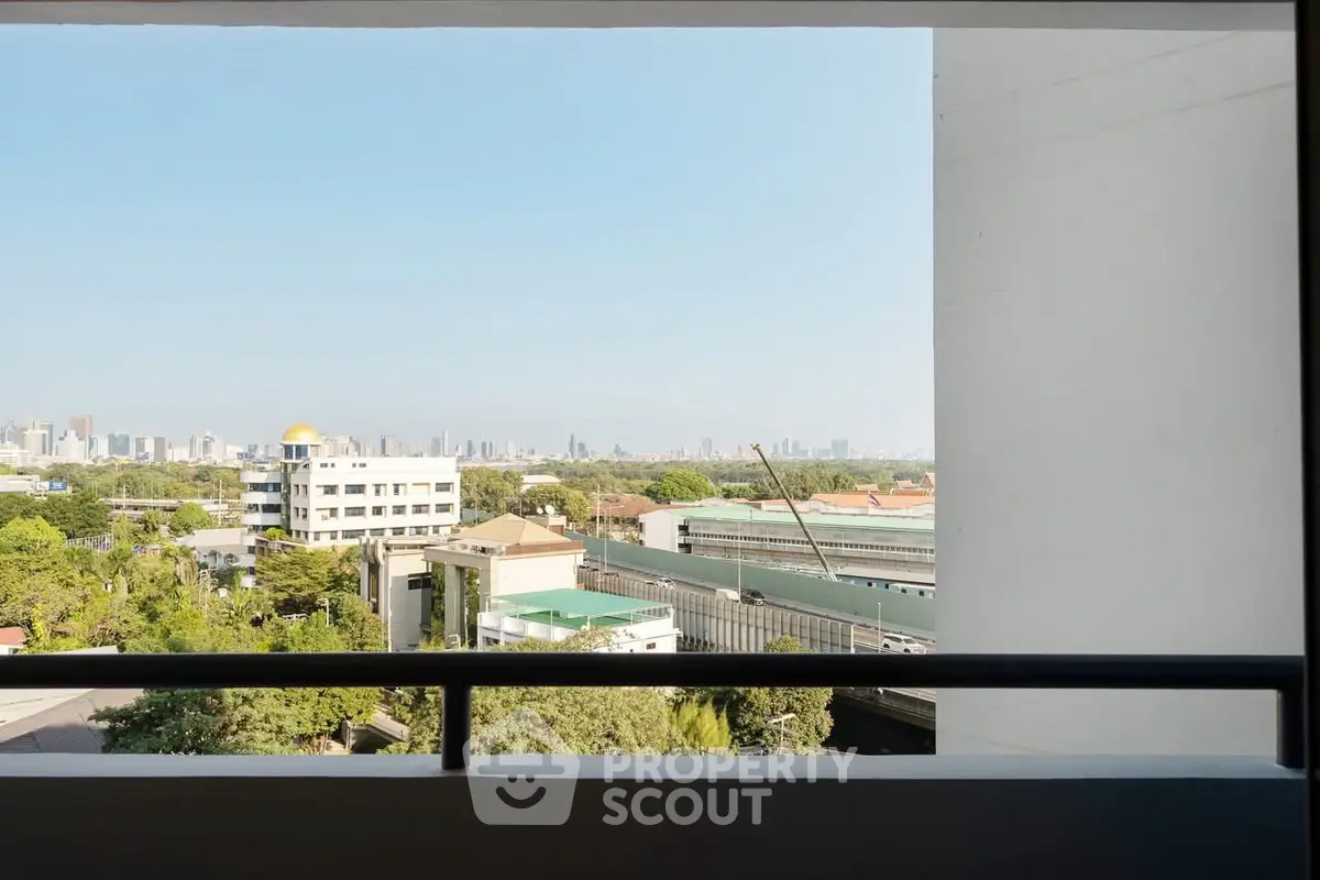 Stunning cityscape view from a high-rise balcony, perfect for urban living.