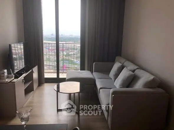Modern living room with cozy sofa and panoramic city view from large window.