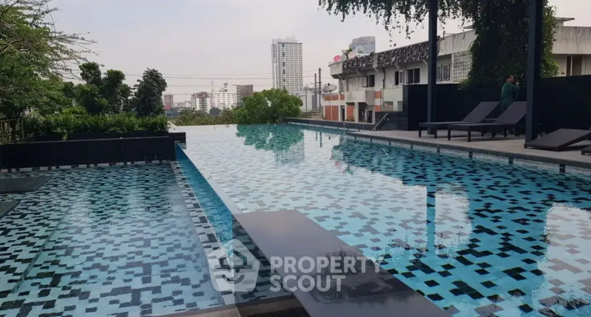 Luxurious outdoor pool with modern design and serene surroundings.