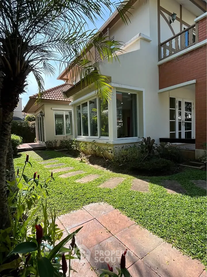 Charming suburban home with lush garden and large windows, perfect for natural light lovers.