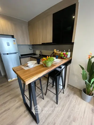 Modern kitchen with wooden cabinets and breakfast bar in stylish apartment