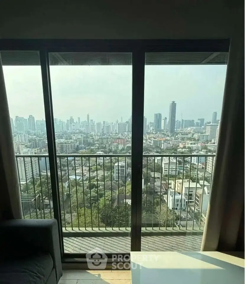 Stunning cityscape view from a high-rise apartment balcony, perfect for urban living enthusiasts.