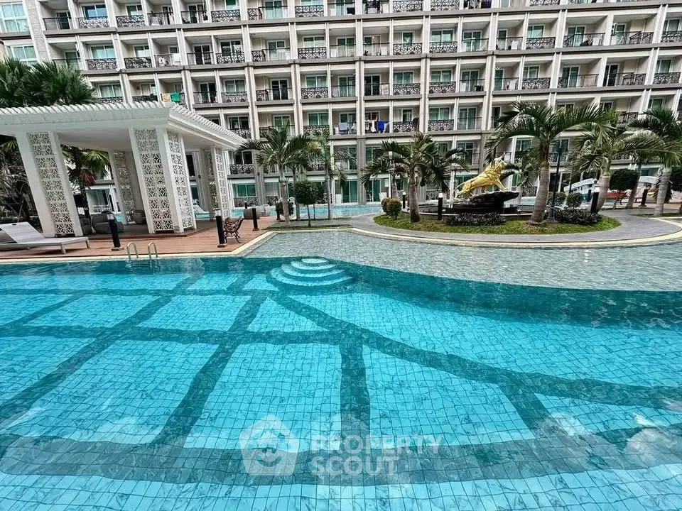 Luxurious apartment complex with stunning pool and lush landscaping