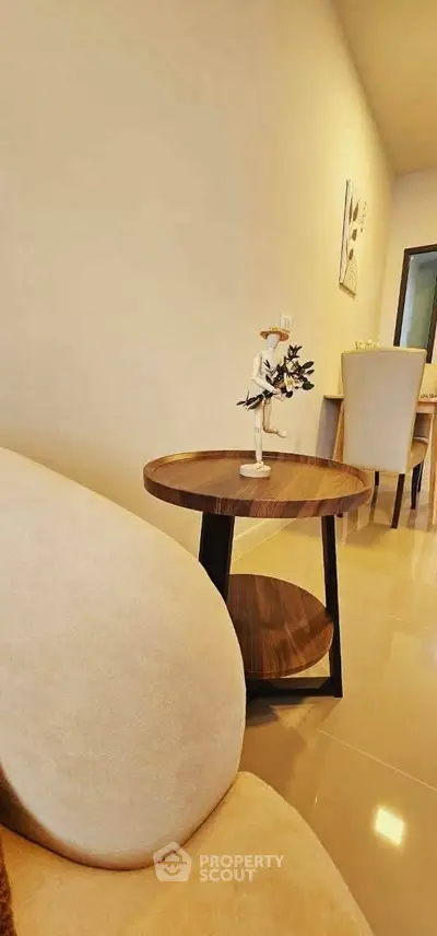 Modern living room with elegant decor and stylish furniture, showcasing a cozy and inviting atmosphere.
