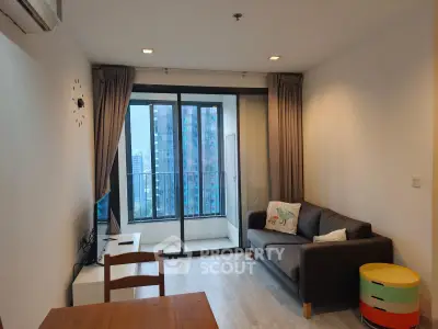 Modern living room with balcony view in high-rise apartment