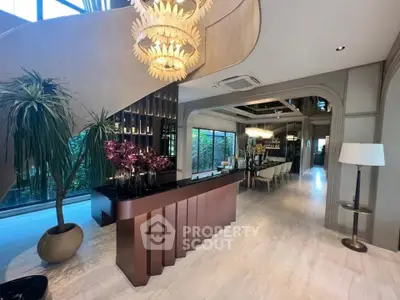 Luxurious modern interior with elegant lighting and stylish decor, showcasing a spacious open layout.