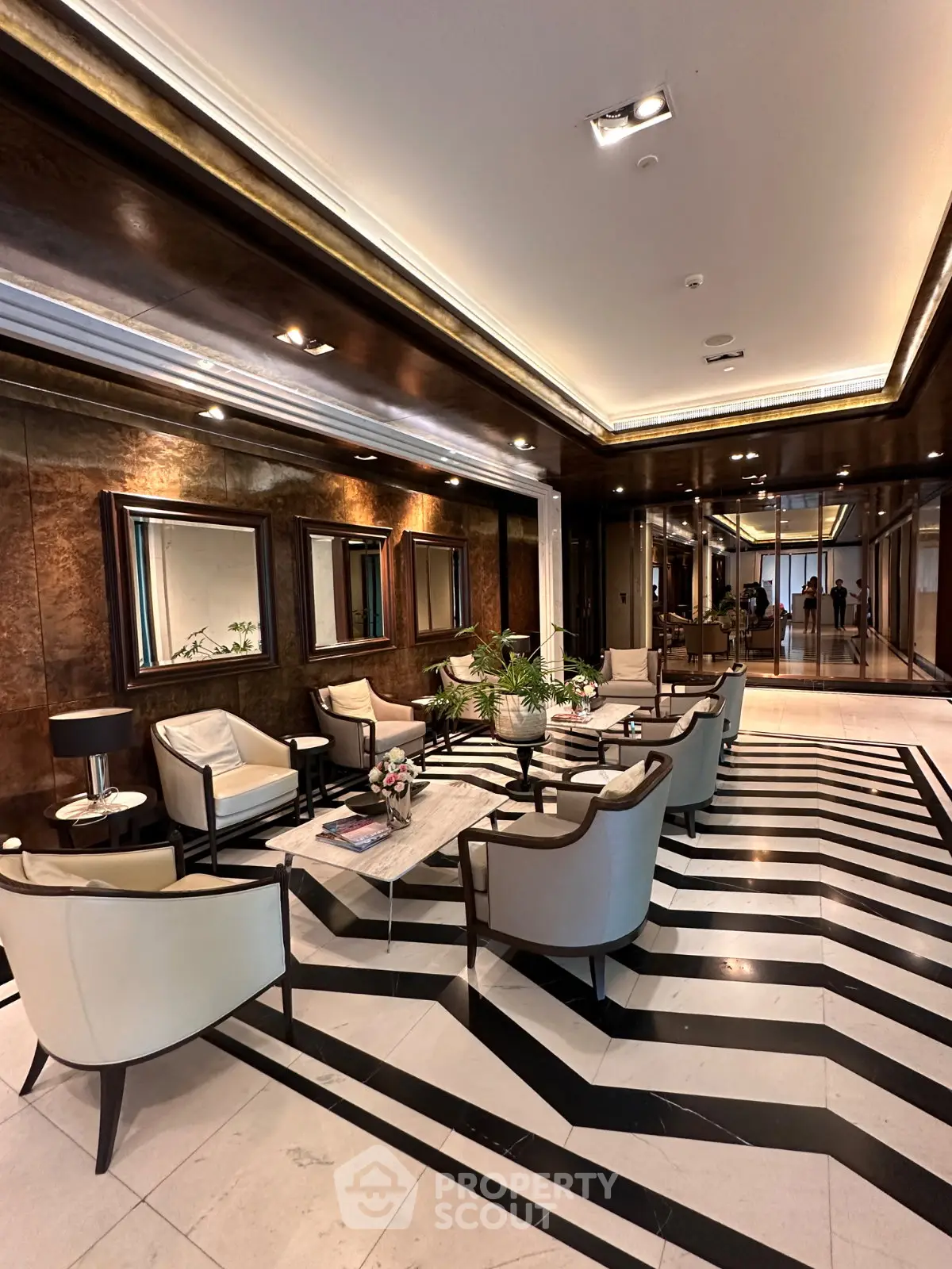Luxurious lobby with elegant seating and modern decor in a high-end building.