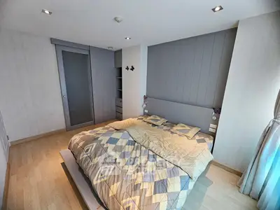 Spacious bedroom with modern design and ample natural light