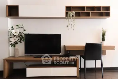 Modern living room with sleek TV unit and stylish desk setup