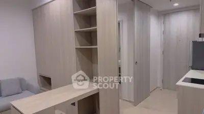 Modern apartment interior with light wood furniture and sleek design