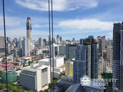 Stunning cityscape view from high-rise apartment showcasing modern urban skyline.