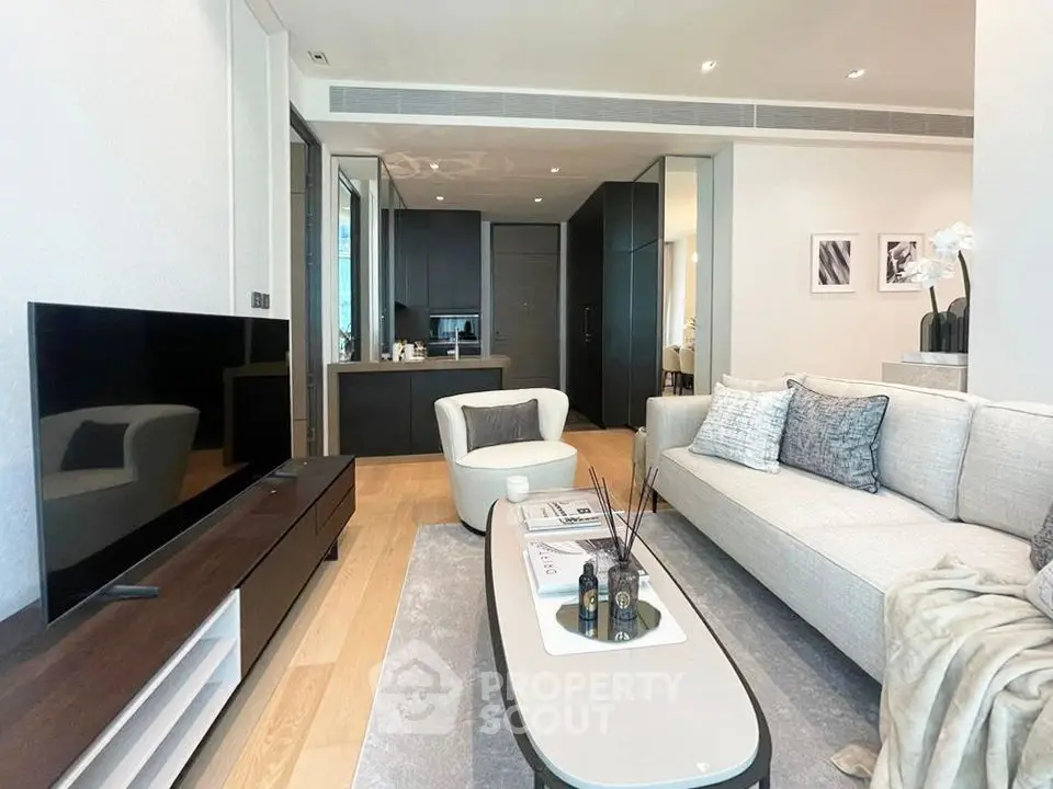 Modern living room with sleek furniture and open kitchen layout, perfect for stylish urban living.