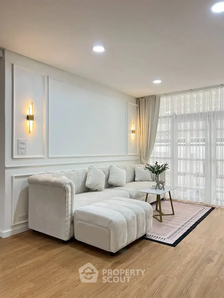 Elegant living room with plush white sofa and modern lighting