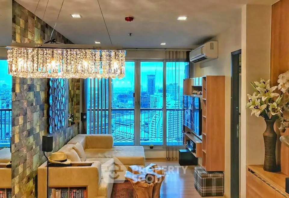 Luxurious living room with city view, elegant chandelier, and modern decor.